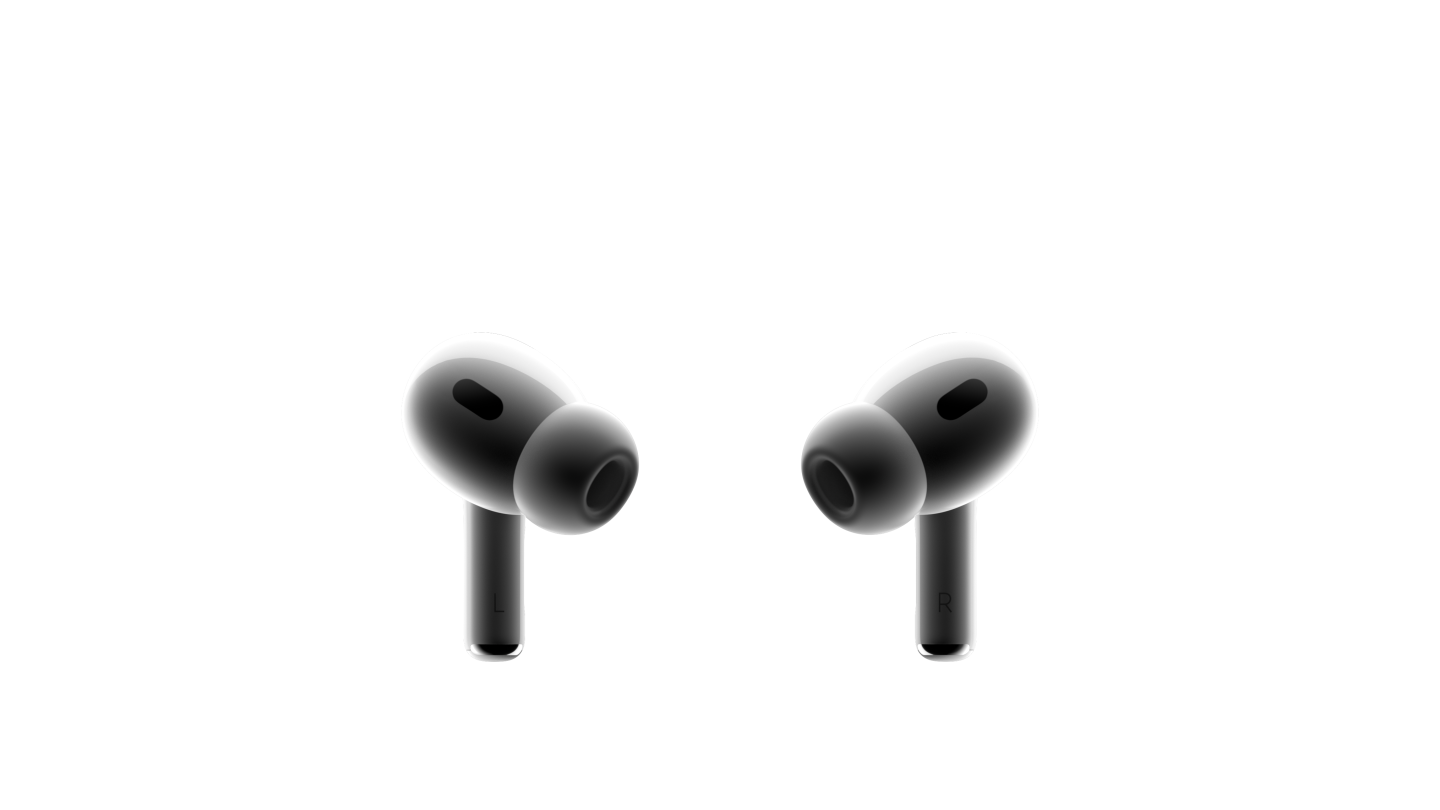 兩只白色的 AirPods Pro 耳機(jī)面對面擺放，外形小巧，均配有黑色網(wǎng)罩，已安裝硅膠耳塞。
