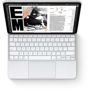 iPad Pro 連接在適用于 iPad Pro 的白色妙控鍵盤上，以俯視視角展示設備搭配鍵盤的效果。
